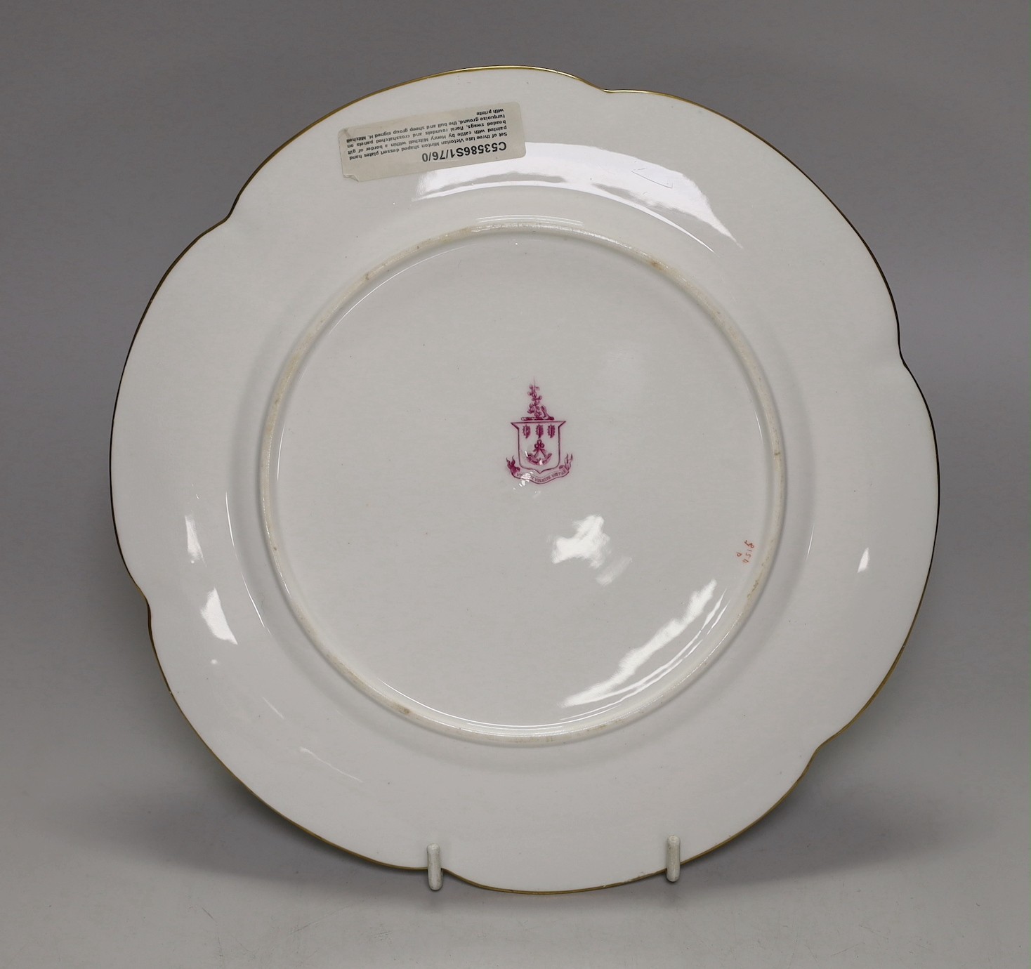 A Minton plate with turquoise, acid etched and raised gilt border painted with a bull and a sheep by Henry Mitchell, signed Henry Mitchell on the rock in the foreground, 24cm